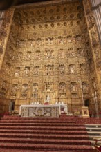Magnificent baroque altar with rich decorations and religious motifs, Seville, Andalusia, Spain