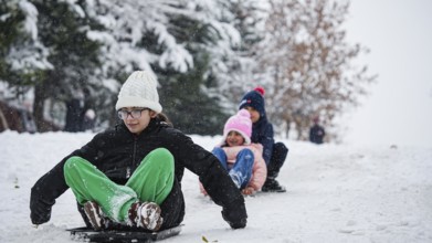 In Gaziantep, Turkey, on December 31, 2025, children and families enjoy winter activities as they