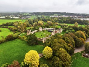 Autumn Colours over ruins of Caldicot Castle from a drone, Caldicot, Monmouthshire, Wales, UK