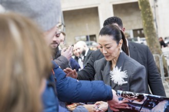 Michelle Yeoh signs autographs ahead of the premiere of the film Everything Everywhere All At Once