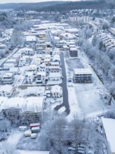 Overview of a snowy cityscape with residential areas and trees, Nagold, Black Forest, Germany