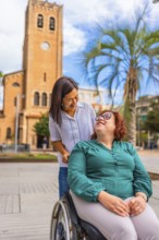 Woman with disability and friend visiting a beauty city walking and pushing the wheelchair downtown