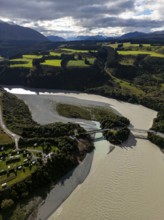 Aerial view captures the diverse landscape of Canterbury, New Zealand, highlighting winding rivers,