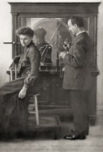 A patient being treated by Proffessor Wilhelm Conrad Röntgen with a direct spark treatment, an