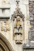 Detail of historic church of Saint John in the Wall, statue of Bellinus, Broad Street, Bristol,