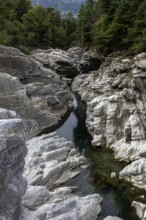 Rocks, granite rock formations in the Maggia River near Ponte Brolla, in the Maggia Valley, Valle