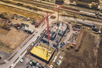 Construction near roads and railways, with significant use of cranes and materials, new Mühlacker