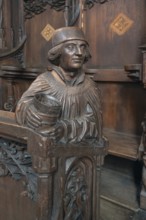 Figure on the late Gothic choir stalls from 1507, St Martin, Memmingen, Bavaria, Germany
