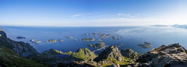 Panorama, view of the sea with numerous small rocky islands with houses, at the summit of