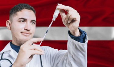 Doctor holding syringe on Latvia flag background. Medical professional holding syringe with Latvian