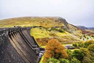Autumn colors over Claerwen Dam, Claerwen Valley, Elan Valley Reservoir, Rhayader, Powys, Wales, UK