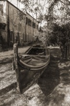 Old gondola in a garden, Giudecca Island, Veneto, Italy