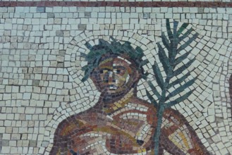 Mosaic depiction of a figure with palm tree, consisting of colorful stones, Museum of the History