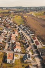 View of a rural residential development with single-family houses and surrounding fields, Ötisheim,