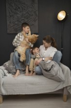 A warm family scene featuring a mother and her two children sharing a joyful moment with their