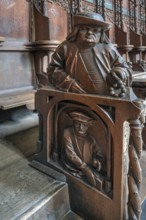 Figures on the late Gothic choir stalls from 1507, St Martin, Memmingen, Bavaria, Germany