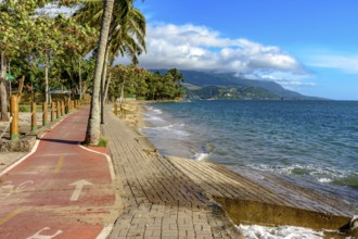 Bike path along the sea in the city of Ilhabela in Sao Paulo, Brazil