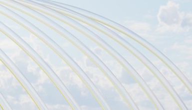 Elegant transparent arcs gracefully intersect against a serene cloudy sky, infused with subtle