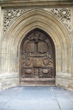 Wooden carved door of the abbey church, Bath, England, United Kingdom