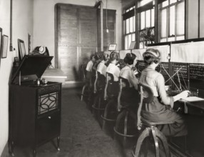 Switchboard operators listening to the Edison‘s phonograph, 1919, digitally edited