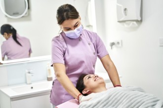 A skilled practitioner provides a soothing massage to a client in a modern beauty salon. The