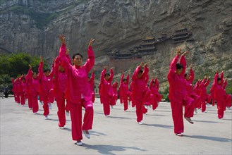 A Group of People Play Tai Ji Quan