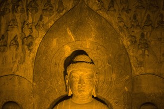 China,Henan Province,Luoyang,Buddhist sculpture at Longmen Grottoes