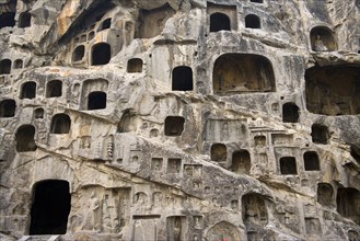 China,Henan Province,Luoyang,Buddhist sculpture at Longmen Grottoes