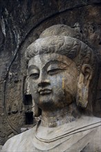 China,Henan Province,Luoyang,Buddhist sculpture at Longmen Grottoes