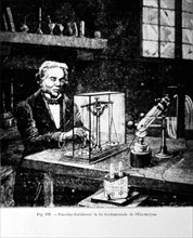 Michael Faraday in his workshop