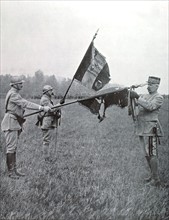 World War I. General Pétain decorating two flags of the "côte 304"