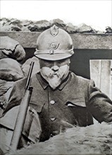 At the front, French President Poincare wearing an infantry helmet, 1916