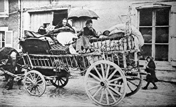 World War I. Evacuated inhabitants of Verdun crossing a village in their wagon
