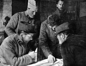 World War I. German prisoners pointing out their artillery positions on a map