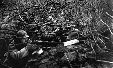 World War I. At the front, an outpost hidden by branches in the middle of a field
