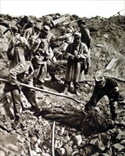 World War I. On the Champagne front, French soldiers getting ready to bury the bodies of German soldiers (1915)