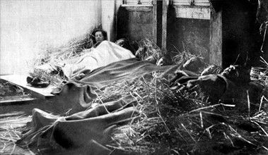 Première Guerre Mondiale. Le soir de noël 1914, réfugiés belges endormis dans une grange
