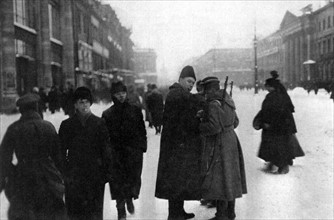 Russian Revolution of 1917. In Petrograd, frisking suspicious civilians