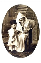 The sultan of Morocco, Sidi Mohammed ben Yussef, and his son (1931)
