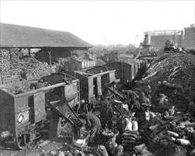 World War I. Sorting coal at La Chapelle station in  Paris (1917)