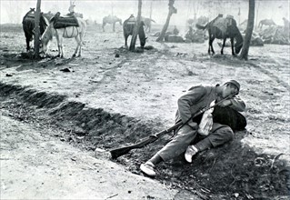 War of the Balkans. A young Montenegro soldier sleeping on the side of a road in Albania (1912)