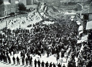 Arab pilgrimage to "Nébi Moussa" (the prophet Moses) passing beneath the walls of Jerusalem (1930)