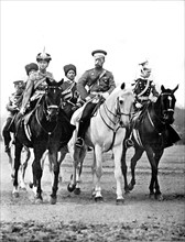 At Peterhof, Nicholas II accompanied by his daughters Olga, colonel of the Hussards, and Tatiana, colonel of the Uhlans (1913)