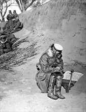 Japanese general studying his map, in a trench away from the Moukden battle (March 1-10, 1905)