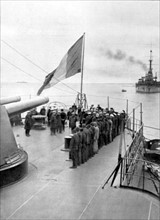 on the quarter-deck of the battleship "Bretagne", the ministry of Navy inspects the officers and some crew members of the wrecked battleship "France" (1922)