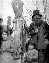 World War I.
In a village of the Lorraine region, soldiers celebrating St. Nicolas' Day for the children of the inhabitants who have not been evacuated (1916)