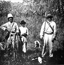 In French Guiana, guards and their dogs chasing escaped prisoners (1930)
