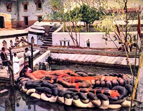 King Changu Narain lying on a snake (Nepal, 1929)