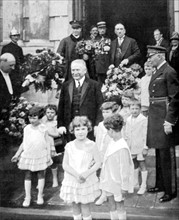 President of the French Republic, Mr. Gaston Doumergue, on the steps of the new Reims townhall, is welcomed by a children's delegation (1928)