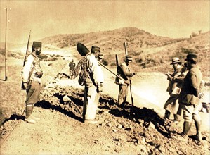 Disciplinary camp in the South of Algeria. Journalist  Albert Londres interviewing disciplinaries working on a road on construction (1924)